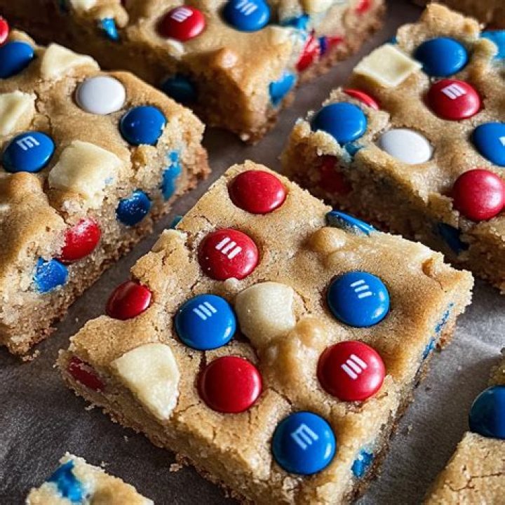 Assembling M&M cookie mix in a jar.